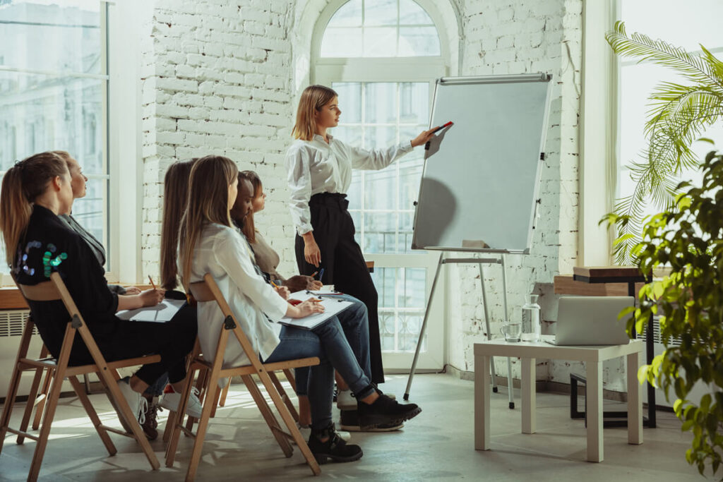 female-teacher-giving-presentation.jpg